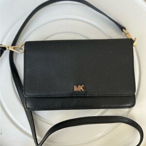 Michael Kors Jet Set Charm Small Phone Crossbody in black pebbled leather.
